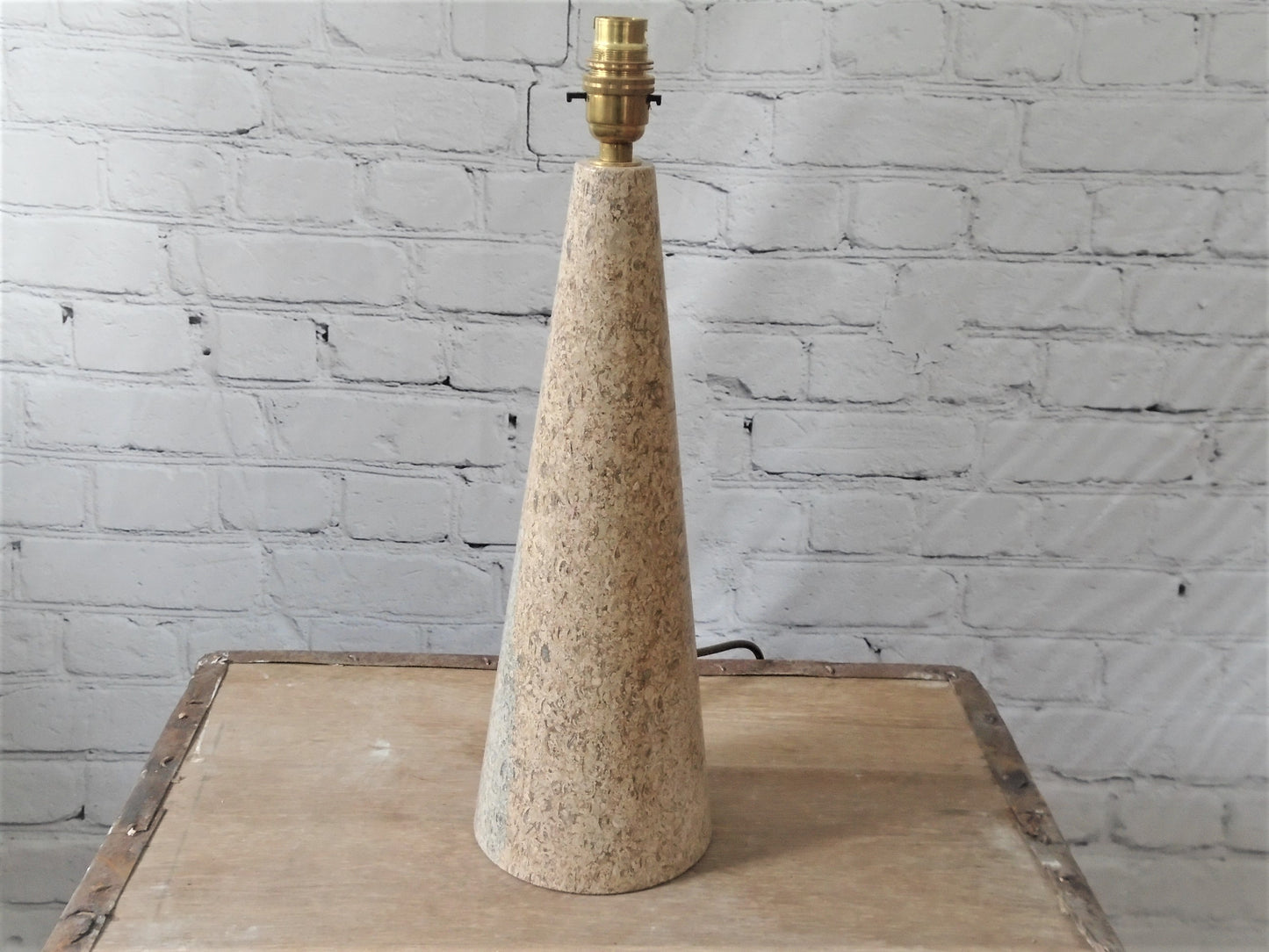 A Conical Polished Limestone Lamp Base