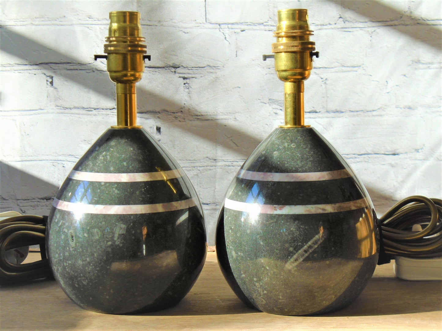 A Pair of Table/Bedside Lamps turned from Kilkenny Fossil with Fleur de Peche Bands