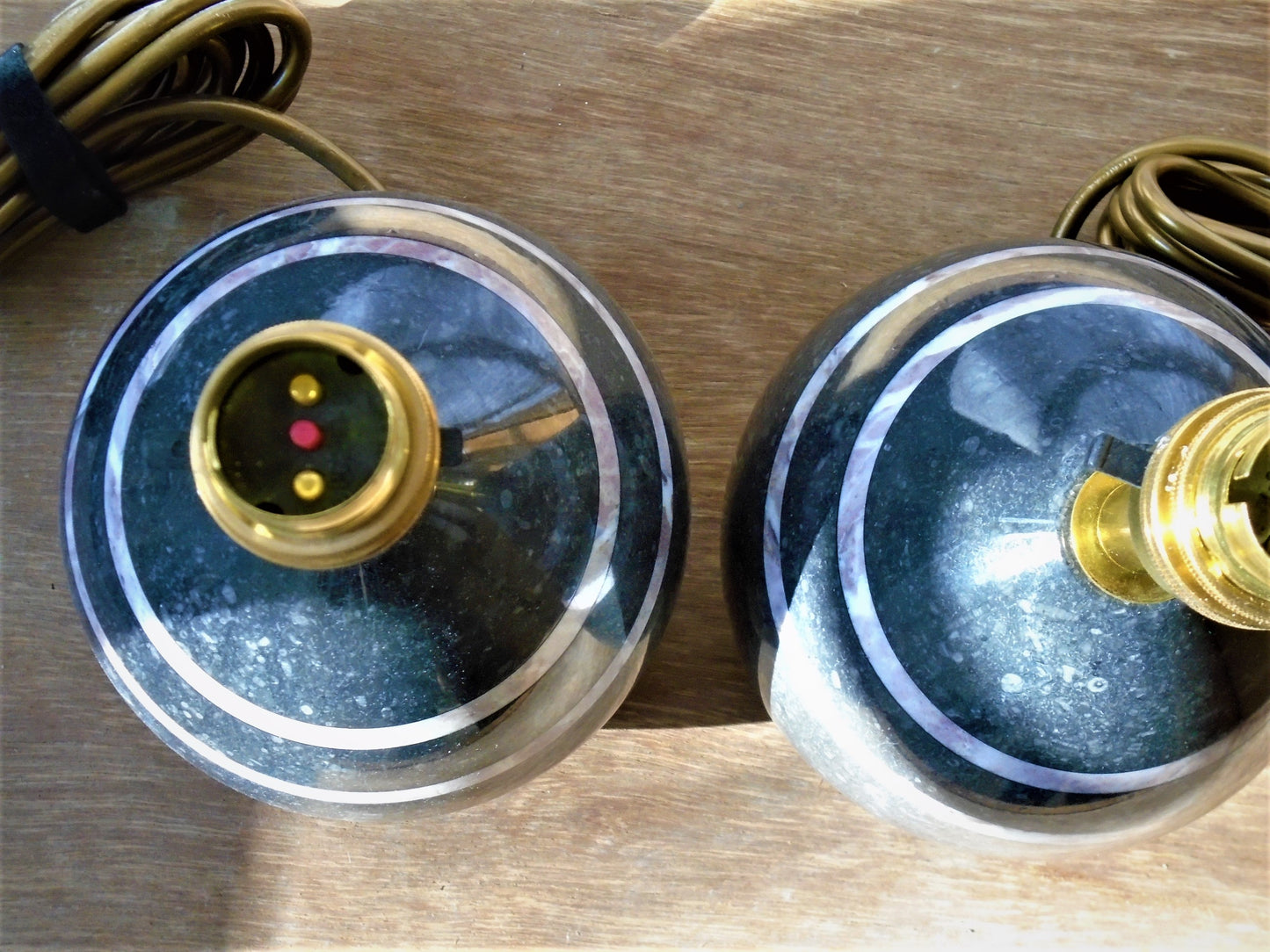 A Pair of Table/Bedside Lamps turned from Kilkenny Fossil with Fleur de Peche Bands