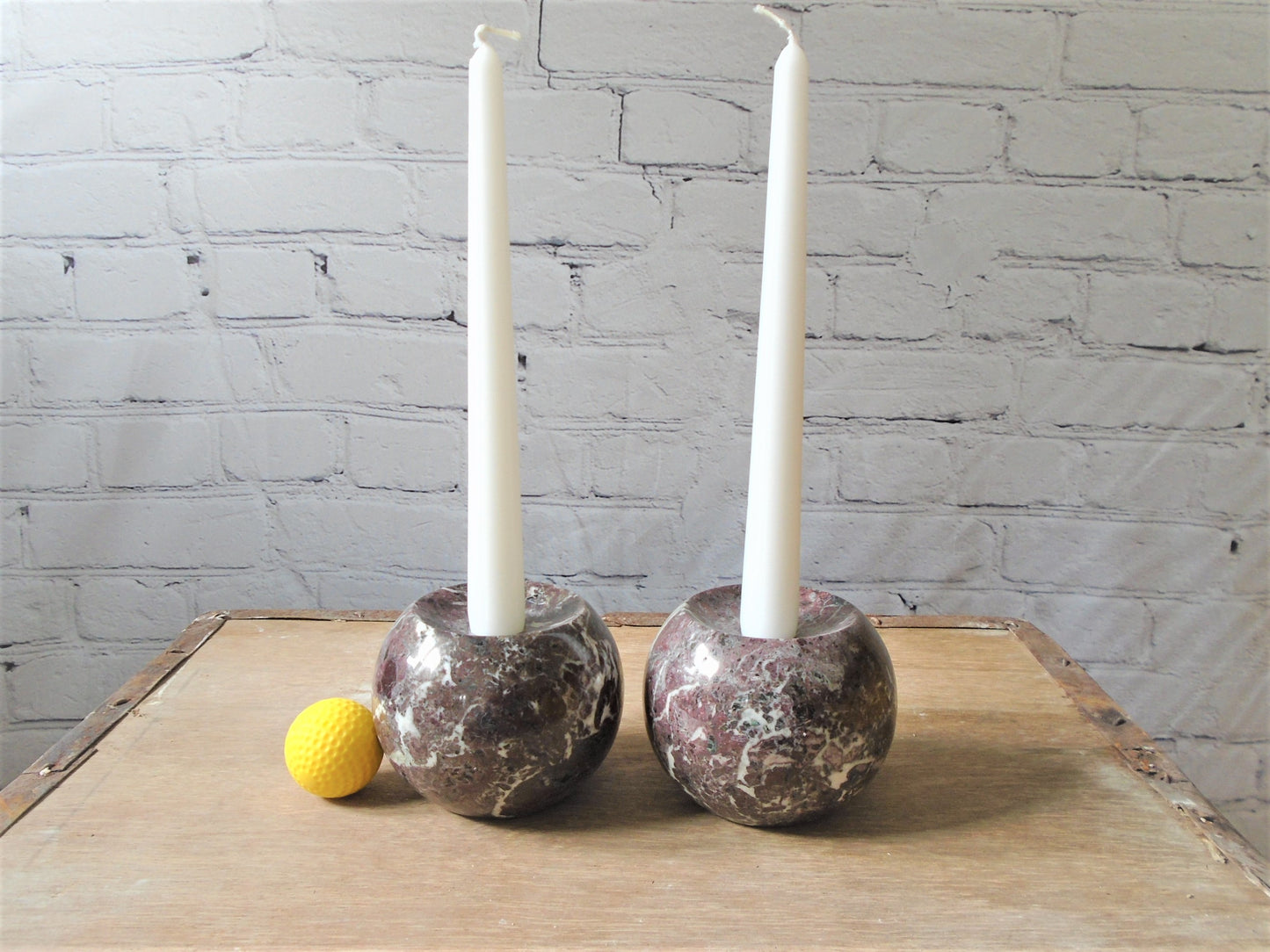 A Pair of Rosso Levanto Marble Candle Holders