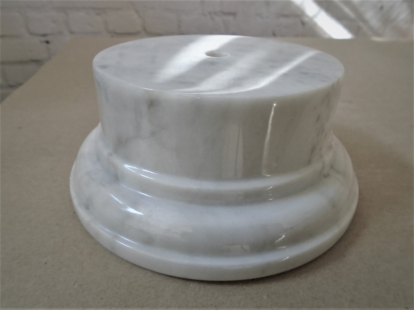 A Carrara White Marble Socle