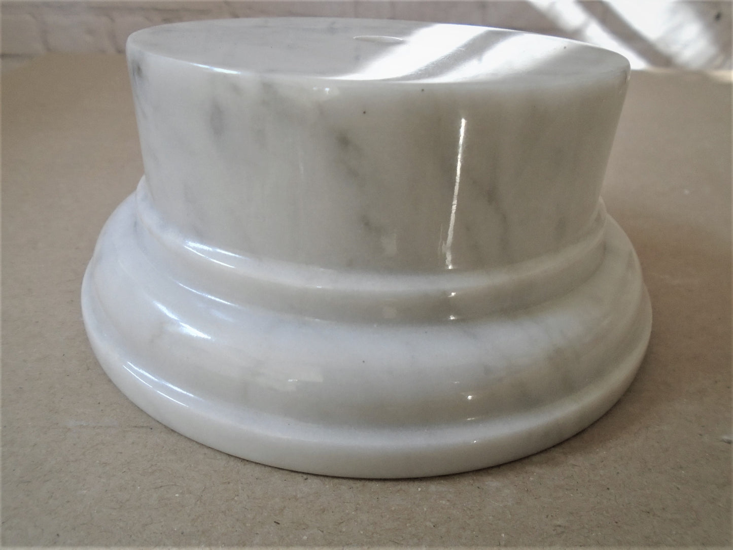 A Carrara White Marble Socle