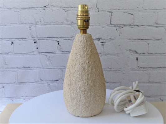 A Tear Drop Shaped Lamp Base with a Rustic Texture Finish