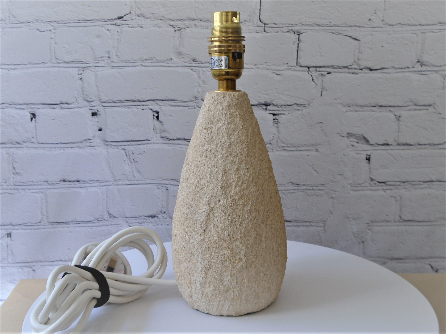 A Tear Drop Shaped Lamp Base with a Rustic Texture Finish