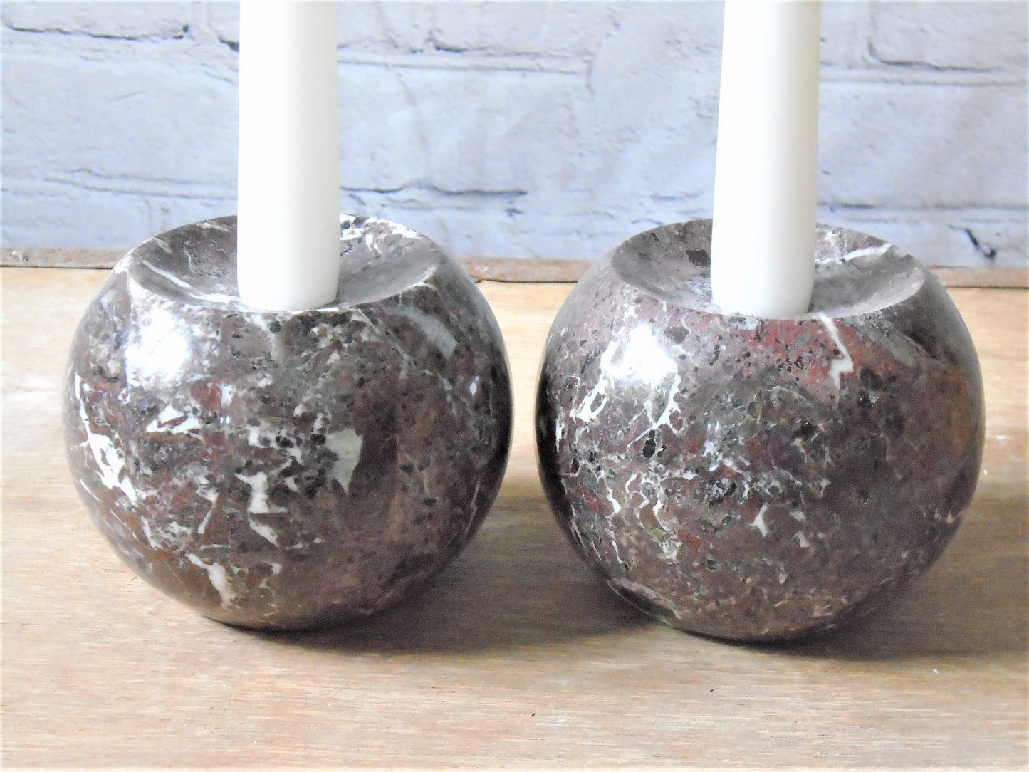 A Pair of Rosso Levanto Marble Candle Holders